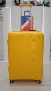 Чемодан 24 дюйма American Tourister Soundbox Spinner желтый из полипропилена